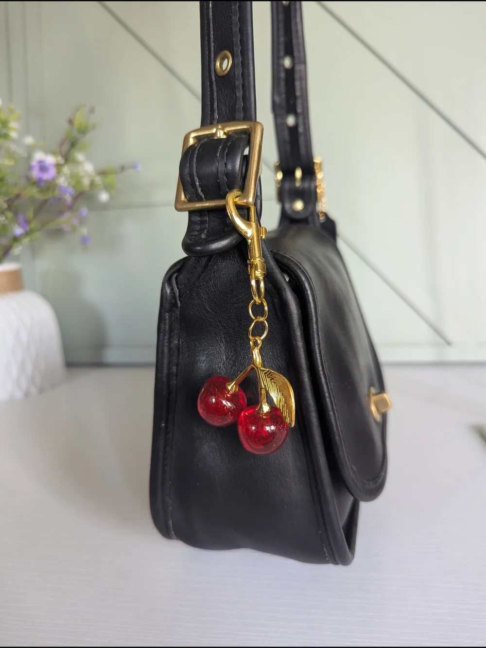 Coach Black Leather Crossbody with Gold Hardware and Cherry Charm